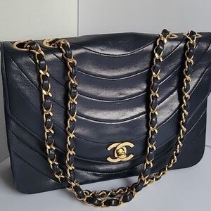 Chanel an  Black Quilted Lambskin Shoulder Bag with 24k gold plated Gold Chain.